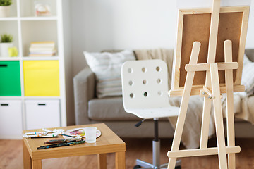 Image showing easel and artistic tools at home or art studio