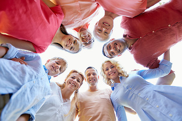 Image showing happy family looking down standing in circle