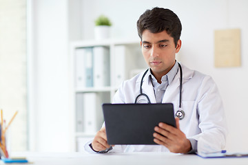 Image showing doctor with tablet pc and stethoscope at clinic