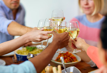 Image showing hands clinking wine glasses