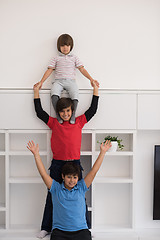 Image showing young boys posing line up piggyback