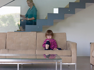 Image showing little girl playing games on smartphone