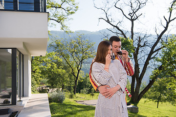 Image showing Young beautiful couple in bathrobes