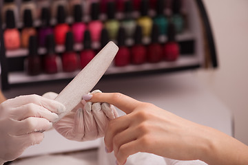 Image showing Woman hands receiving a manicure