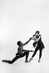 Image showing A happy family of ballet dancers on white studio background