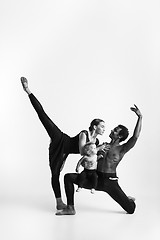 Image showing A happy family of ballet dancers on white studio background