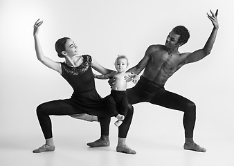 Image showing A happy family of ballet dancers on white studio background