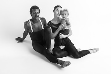 Image showing A happy family of ballet dancers on white studio background