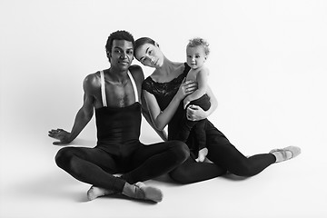 Image showing A happy family of ballet dancers on white studio background