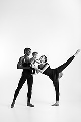 Image showing A happy family of ballet dancers on white studio background