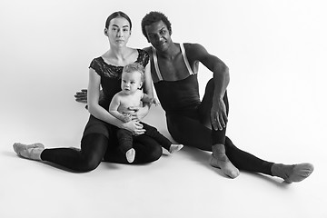 Image showing A happy family of ballet dancers on white studio background