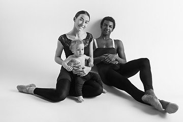 Image showing A happy family of ballet dancers on white studio background