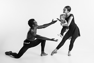 Image showing A happy family of ballet dancers on white studio background