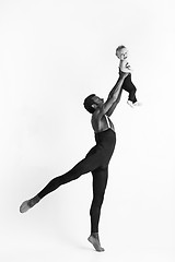 Image showing A happy family of ballet dancers on white studio background