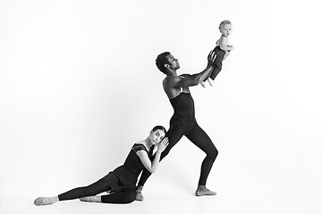 Image showing A happy family of ballet dancers on white studio background