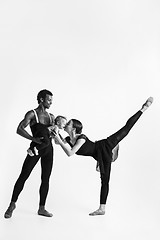 Image showing A happy family of ballet dancers on white studio background