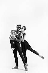 Image showing A happy family of ballet dancers on white studio background