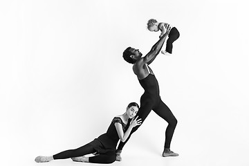 Image showing A happy family of ballet dancers on white studio background