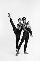 Image showing A happy family of ballet dancers on white studio background