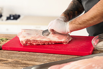 Image showing Man cooking meat steak on kitchen