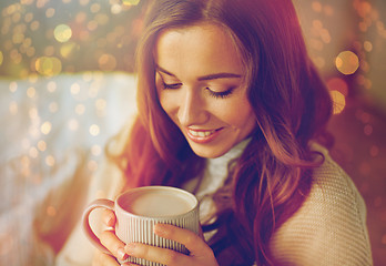 Image showing close up of woman drinking cocoa at christmas