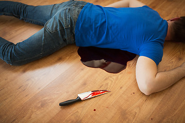 Image showing dead man body lying on floor at crime scene