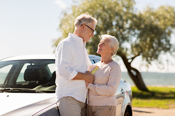 Image showing happy senior couple with car in summer