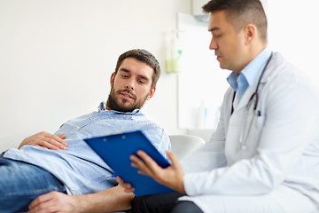 Image showing doctor and man with health problem at hospital