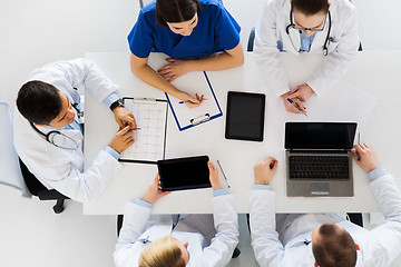 Image showing doctors with cardiogram and computers at hospital