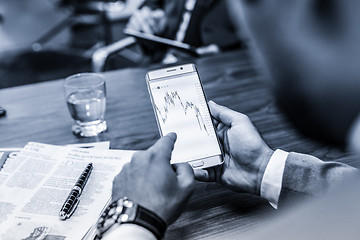 Image showing Close up of businessman using mobile smart phone.