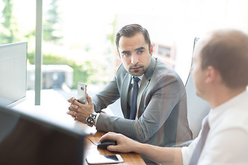 Image showing Business team brainstorming and dicussing business ideas at business meeting.