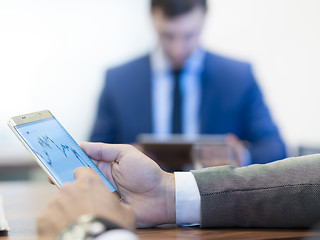 Image showing Close up of businessman using mobile smart phone.