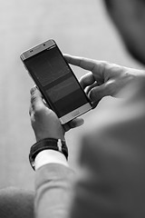 Image showing Close up of businessman using mobile smart phone.