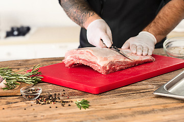 Image showing Man cooking meat steak on kitchen