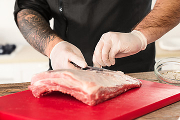 Image showing Man cooking meat steak on kitchen