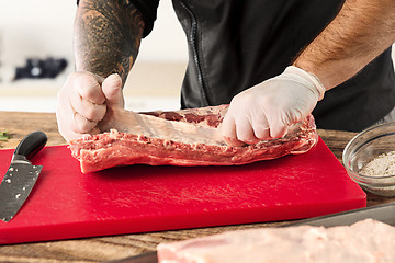 Image showing Man cooking meat steak on kitchen