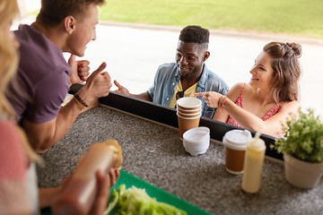 Image showing customers couple ordering something at food truck