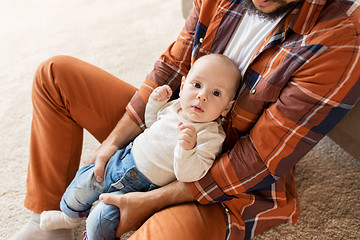 Image showing happy father with little baby boy at home