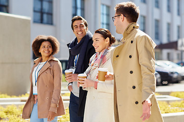 Image showing office workers with coffee on city street