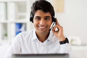 Image showing businessman with headset and computer at office
