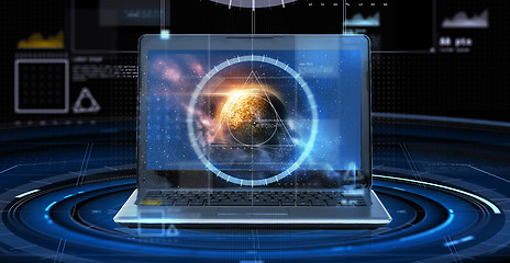 Image showing laptop with virtual planet and space hologram