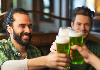 Image showing male friends drinking green beer at bar or pub