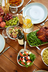 Image showing various food on served wooden table