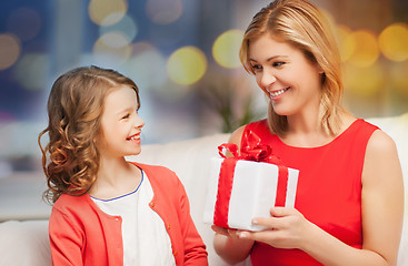 Image showing happy mother and daughter with gift box