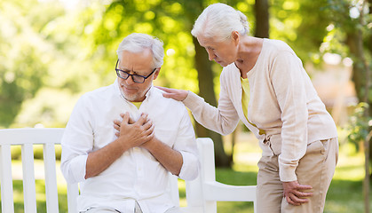 Image showing senior man feeling sick at summer park