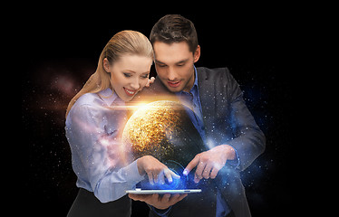 Image showing businesspeople with tablet pc and planets in space