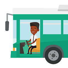 Image showing African bus driver sitting at steering wheel.