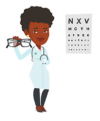 Image showing Professional ophthalmologist holding eyeglasses.