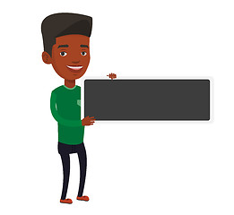 Image showing Young african-american man holding blank board.