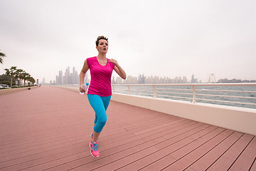 Image showing woman running on the promenade